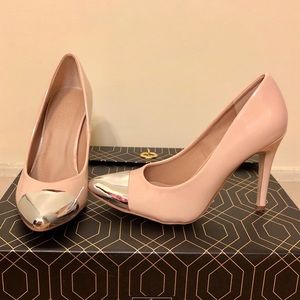 Baby pink heels with silver pointed tips